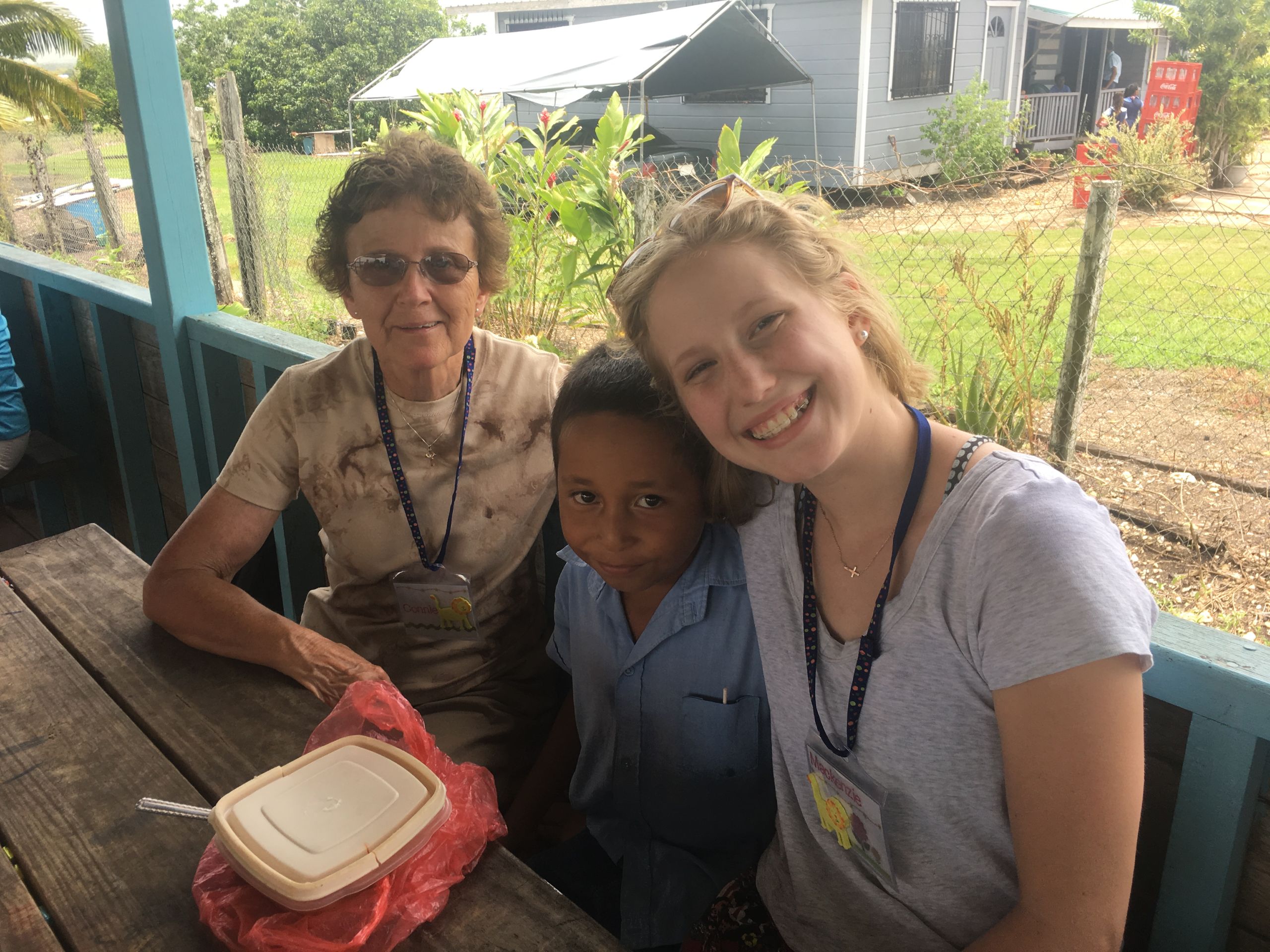 volunteers with a student volunteers with a student