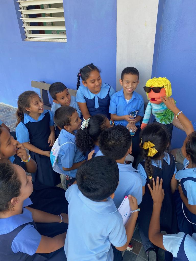 students with puppet students with puppet